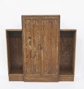 Early 20th century oak Art Deco style bookcase, two central panelled doors flanked by open