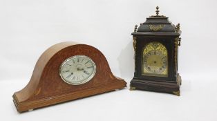 Bird's eye maple Napoleon hat shaped mantel clock, with Roman numerals to the oval dial marked 'La