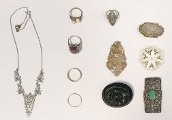 Jet-type oval floral brooch, a silver-coloured metal filigree pendant, a marcasite and jade-coloured