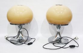 Pair of Harvey Guzzini Italian table lamps with circular silver coloured metal base and globular
