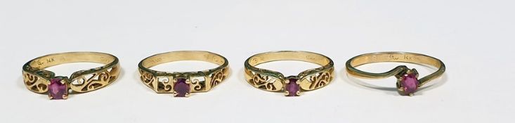 Four 9ct gold and ruby rings, each set single stone in pierced setting (4)  Condition ReportThe ring