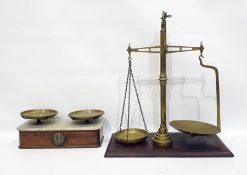 Set of brass scales and one further set of scales