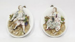 Pair (probably French) relief porcelain portrait plaques in the manner of Jacob Petit,