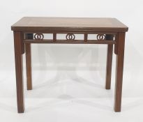 Oriental hardwood altar type table, the rectangular top with rounded corners above carved and