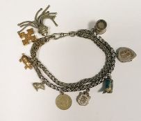 Silver-coloured metal herringbone-pattern chain bracelet with tassel and various charms
