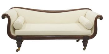 William IV mahogany sofa, cream fabric upholstery, elegantly dipping back rail on scroll arms,