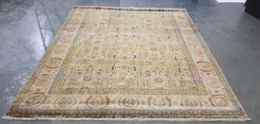 Golden ground Eastern rug with allover foliate decoration in pinks, greens, blues, yellows and