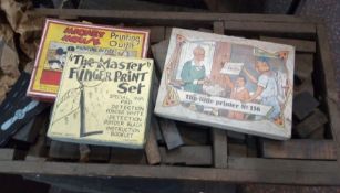 Wooden box of printing blocks and another tray of printing blocks