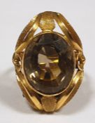 Gold coloured metal and smokey quartz dress ring