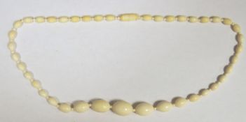 Ivory bead necklace, graduated, oval beads with spacers, 54cm long
