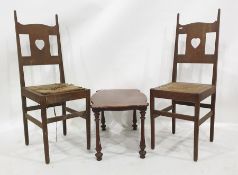 Pair of oak chairs with rush seats and a walnut coffee table (probably originally part of a whatnot)