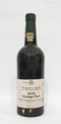 Bottle of Taylors 1975 vintage port, label is complete, wax capsule top is damaged but present