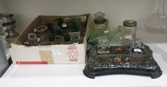 Collection of glass and metal-mounted inkwells, various medical bottles, an eye bath, a measuring
