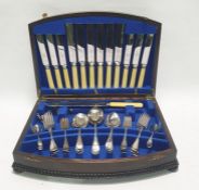 EPNS table service of Old English pattern flatware for six persons by Viners, in oak tabletop