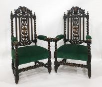 Pair of Victorian oak armchairs in the Gothic-taste, the top rail with green mask, backsplat