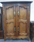 French armoire with two doors enclosing hanging space, brass escutcheons and hinges