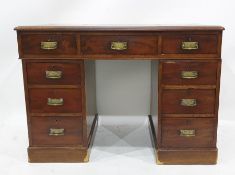 19th century mahogany desk with red leather inset top, nine assorted drawers, on plinth base,
