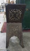 Eastern style folding magazine rack with carved and pierced decoration