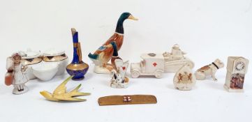 Alexandra china Goss-style porcelain tank, another Goss-style model dog, a Red Cross van, two