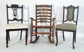 Oak ladderback rush-seated rocking chair and two further chairs (3)