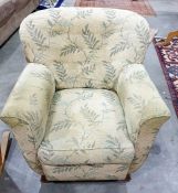 Armchair in green loose covers