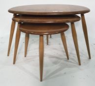 Nest of three light elm Ercol 'Pebble' tables