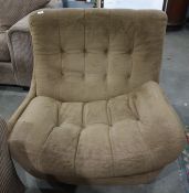 Mid twentieth century Englander designer swivel chair, upholstered in brown with buttonbackCondition