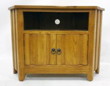 20th century oak television stand with open recess above two cupboard doors