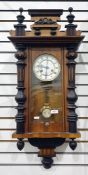 Vienna regulator style wall clock in elaborately carved case with brass bezel face, white enamelled,