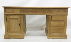 Modern oak desk, the rectangular top with moulded edge, assorted drawers and cupboard doors, the