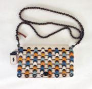 Coach cross-body turn-lock bag with patterned front flap, blue, cream, ochre, turquoise and orange