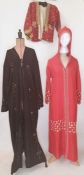 Red silk and embroidered hooded kaftan, a black kaftan embroidered assuit-style with metal pieces