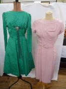 Carnegie watered satin cocktail dress with scoop neck, zip to the back, bow and diamante detail to