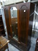 Early 20th century mahogany single mirrored door wardrobe above single drawer, on plinth base, 112cm