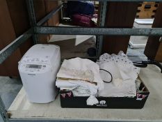 Panasonic bread maker, electric small lightweight hoover and a box of assorted bed linen