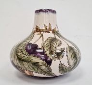 Cobridge squat baluster-shaped vase decorated with plums on vine, marked to base ‘RB’ and ‘GP’,