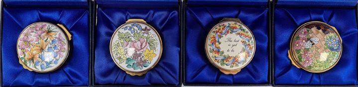 Four Kingsley enamel patch boxes, circular and floral decorated, all boxed