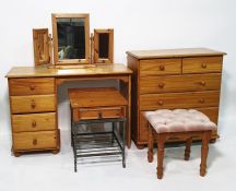 Modern pine chest of two short over three long drawers, a dressing table, a three-part mirror, a
