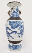 Japanese porcelain and stoneware crackle-glazed baluster vase with charging warriors in underglaze