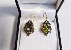 Pair of drop earrings set with cabochon peridot and diamonds, boxed
