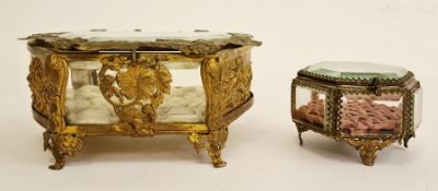 Two brass and glass jewellery boxesCondition ReportThe cushion inside the bigger one is frayed as