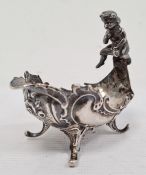 Continental silver trinket dish, oval with scroll and cherub handle, foliate scroll decorated, on