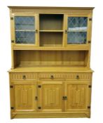 20th century oak dresser with moulded pediment above two lead glazed doors, central open shelves,