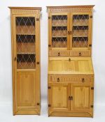 Modern light oak bureau bookcase, the moulded pediment above leaded glazed doors enclosing