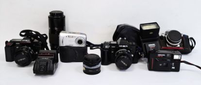 Two boxes comprising various digital and other cameras to include Minolta, Olympus, flashes, lens,