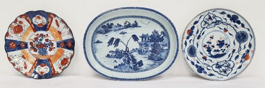 18th century Chinese porcelain shallow dish, rounded oblong with pagoda in lakeside landscape, in