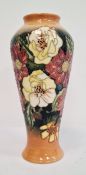 Moorcroft vase by Emma Bossons, of inverted baluster form, white and red flowers, signed to base ‘