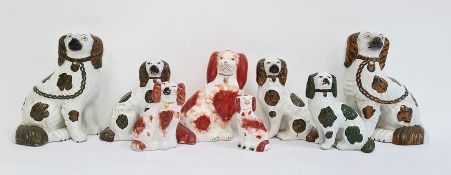 Collection of Staffordshire pottery spaniels to include pair copper lustre decorated spaniels, a