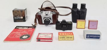 Zeiss Ikon camera in leather case, a Olympus 50mm F1.8 zoom lens and various other camera equipment
