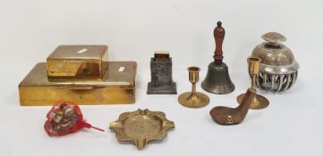 Two various brass cigarette boxes, an engraved elephant bell decorated with peacocks, a brass